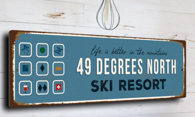 photo of a sign for "49 DEGREES NORTH SKI RESORT" with the slogan "life is better in the mountains"