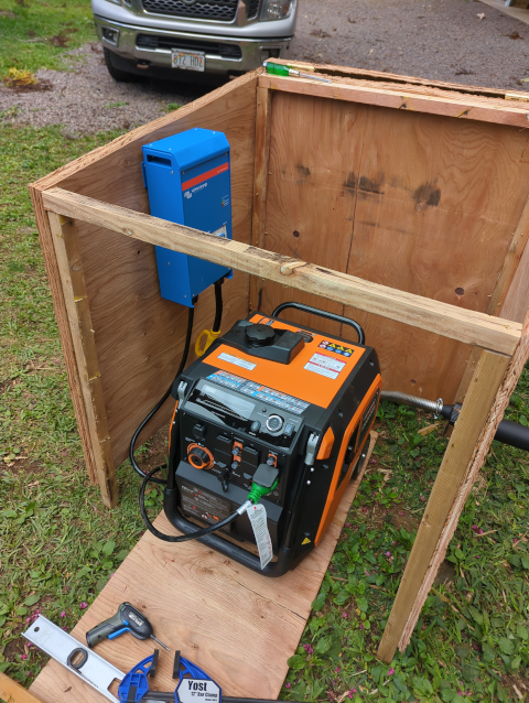 photo of the generator house with the blue autotransformer bolted to one wall