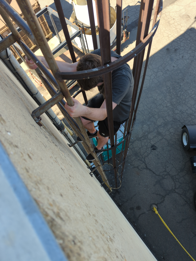 Josh climbing the long, scary ladder
