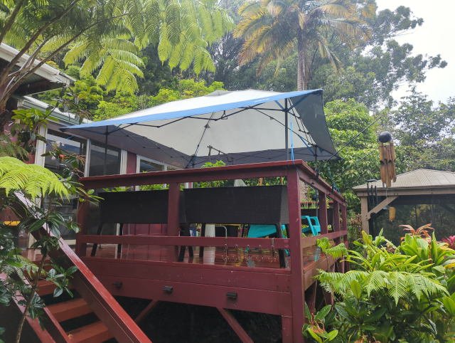 photo looking up at our back deck, with a 13'x13' canopy erected over it