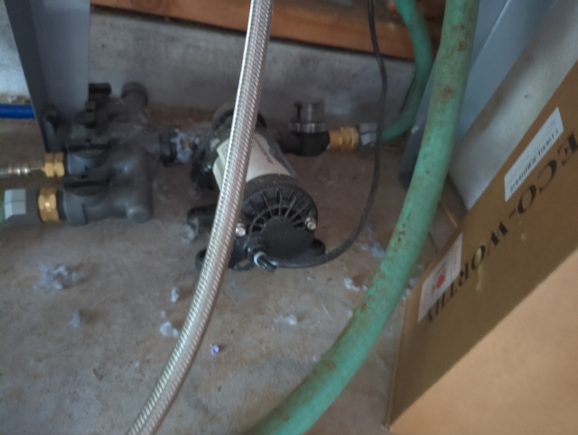 photo of a small diaphragm pump under our laundry sink