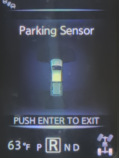 photo of the dashboard display of our Nissan Titan truck reading "PUSH ENTER TO EXIT"