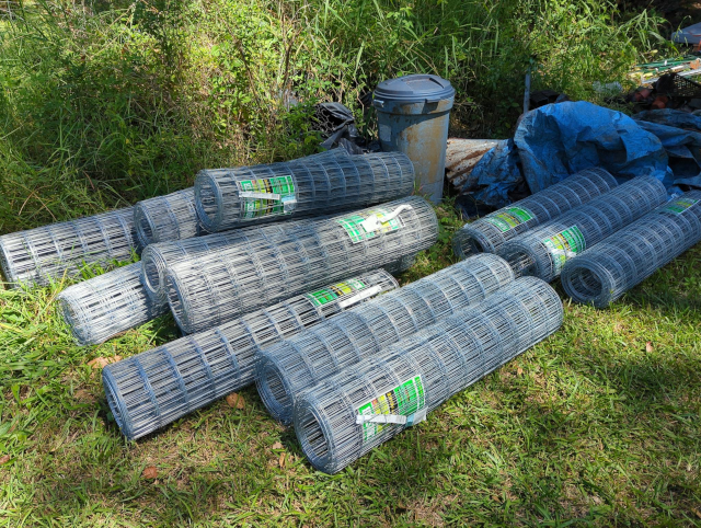 a photograph of rolls of welded-wire mesh fencing material