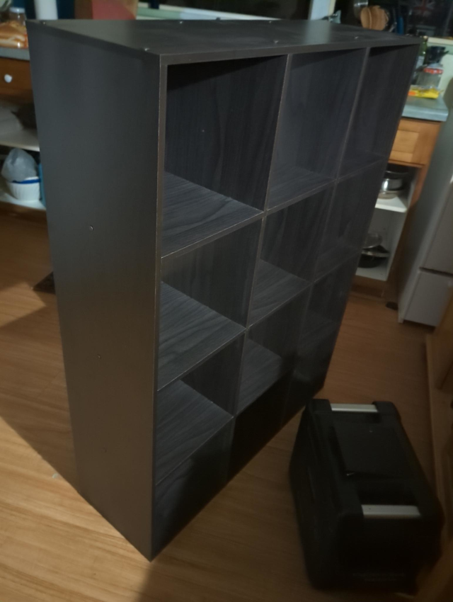 photograph of an assembled 12-cubby flatpack cabinet