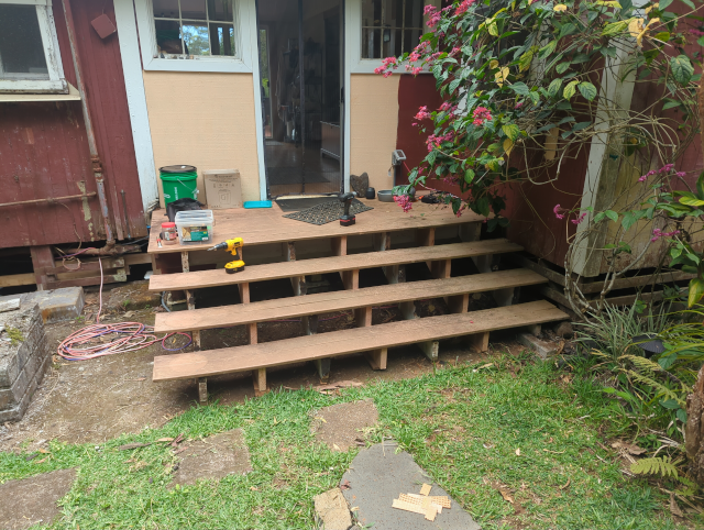photo of the front steps with the decking boards replaced, ready for new risers