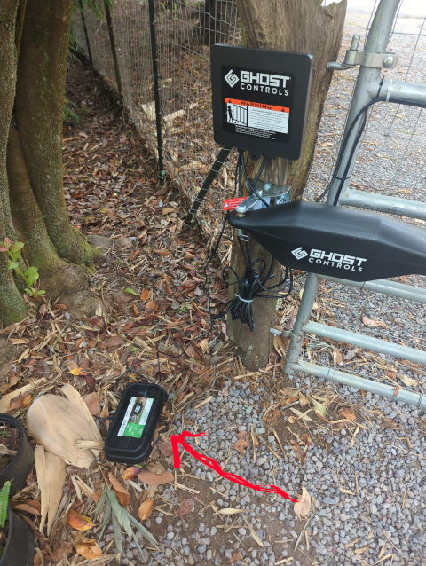 photo of a weatherproof box under a driveway gate actuator