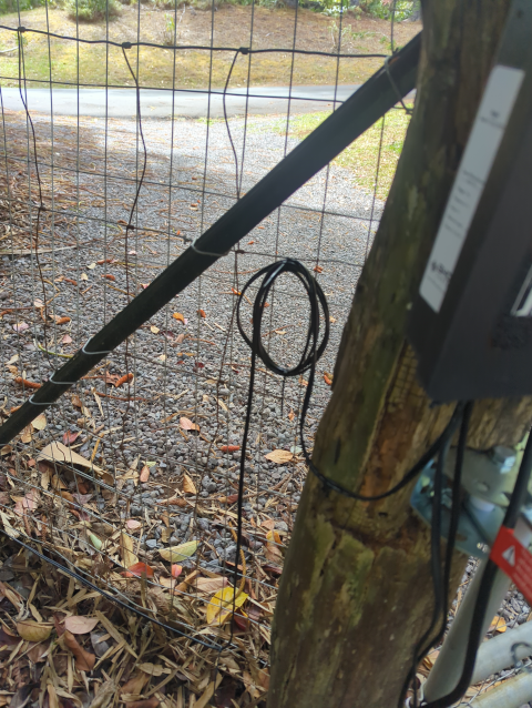 photo of the solar solar charging cable running into the gate controller, with some reserve for revisions