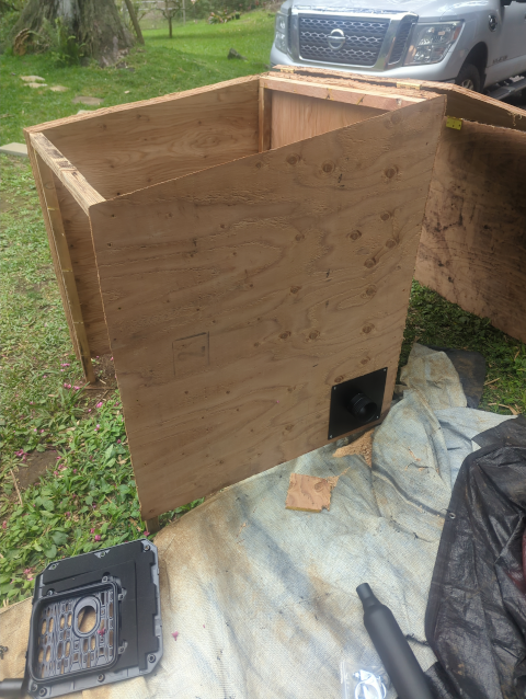 photo of the Zombie Box exhaust pipe and muffler coming out the side of the generator house