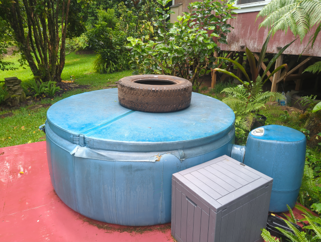 photo of the hot tub with a large truck tire resting atop