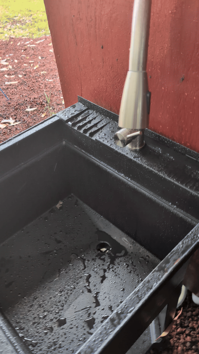 animated gif of a laundry sink; a hand reaches out, turns on the water, and water flows for a few seconds before it is turned off