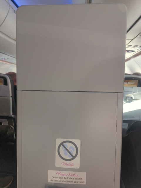 photo from sitting position in my seat, showing the Great Wall in front of me blocking any view.