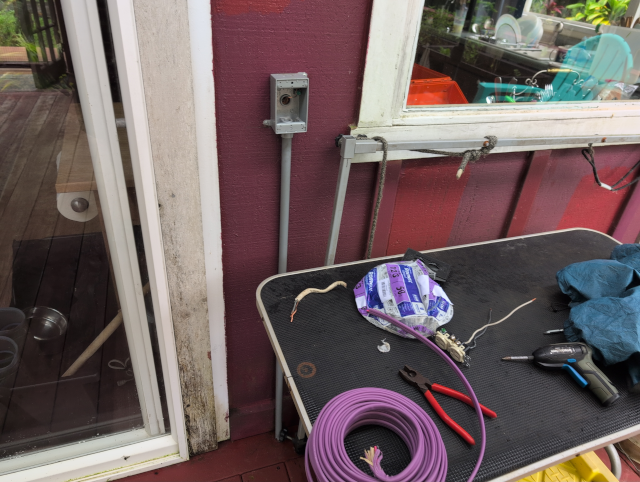 photo showing a disassembled duplex outdoor outlet