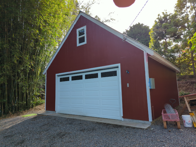 photo of the new garage with a fresh coat of barn-red paint