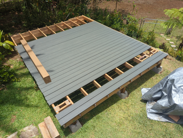 photo of the deck with two conspicuous gaps in the decking.