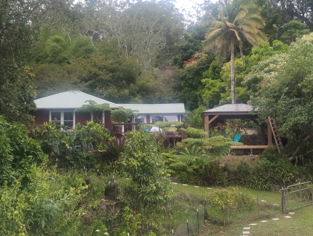 photo from the pasture, looking at the back of the house with the new pavilion to the right