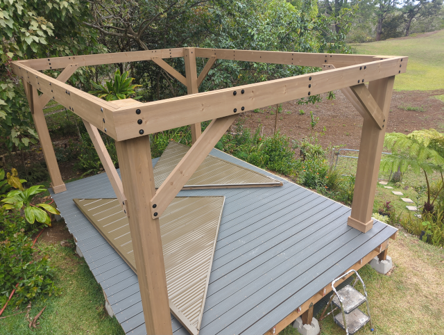 photo of the pavilion under construction showing two completed short-side roof panels