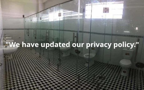 meme showing a public restroom with stalls made of clear glass walls and doors, with the caption "We have updated our privacy policy."