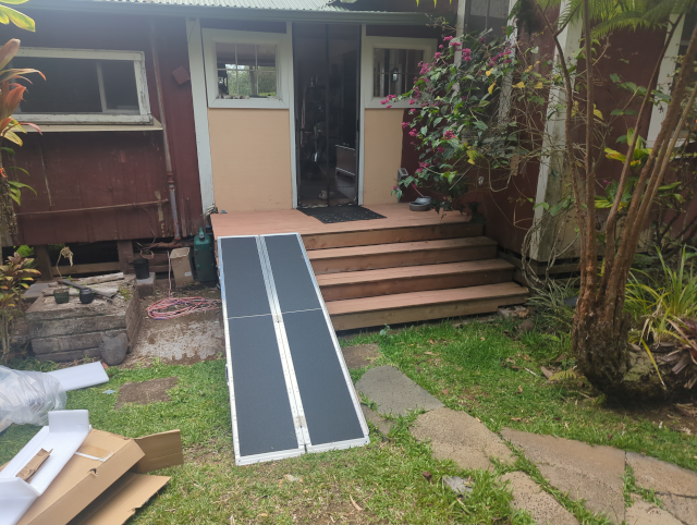 photo of an aluminum wheelchair ramp at our front door