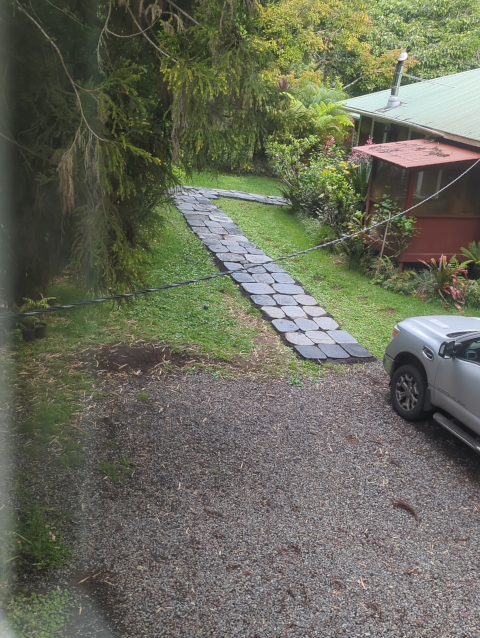 photo looking down at the path from the loft; the rocks are of various shades as they're drying