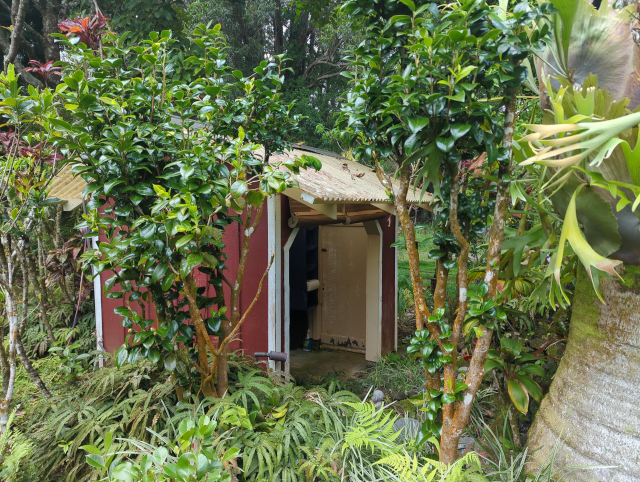 photo showing the outdoor shower from the outside with the shades up