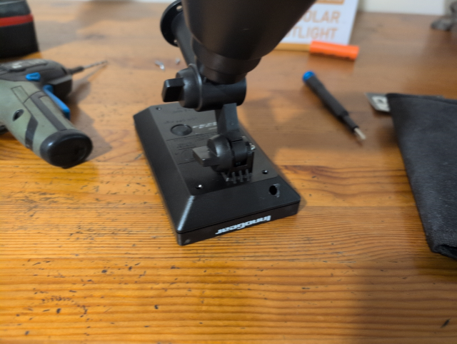 photo showing the solar spotlight with a hole drilled in the corner to the right