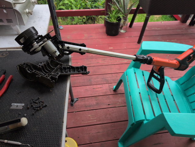 photo of a Black and Decker string trimmer being dismantled