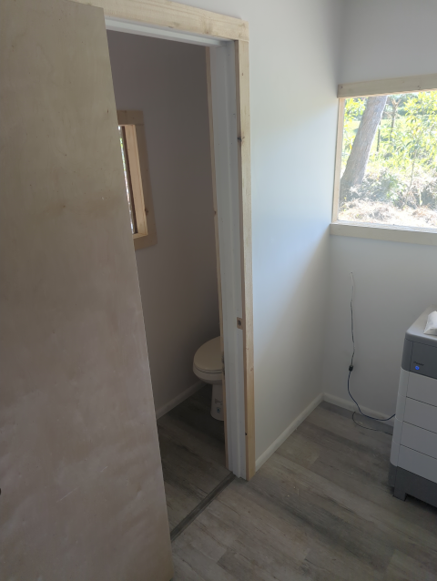 photo in the studio looking at the new wall and door into the new bathroom