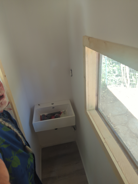 photo of the studio bathroom looking toward the sink; narrow but functional!