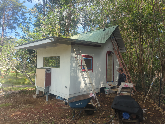 photo of the studio with the windows and doors detailed in red