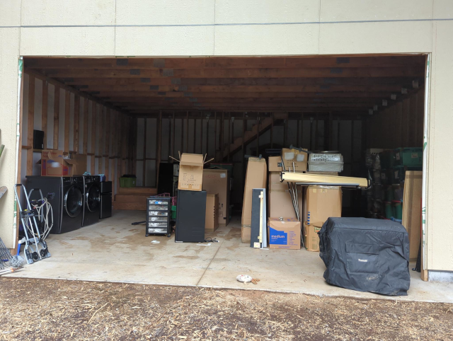 photograph of a garage with many boxes