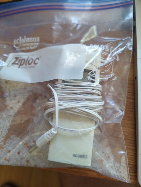 photo of one of the thermometers in a Ziploc bag with some silica gel dessicant