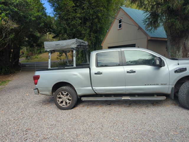 photo of the Nissan Titan pickup truck with a tent-on-top camper installed