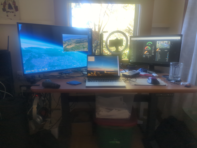 photo of my desk, now with three monitors